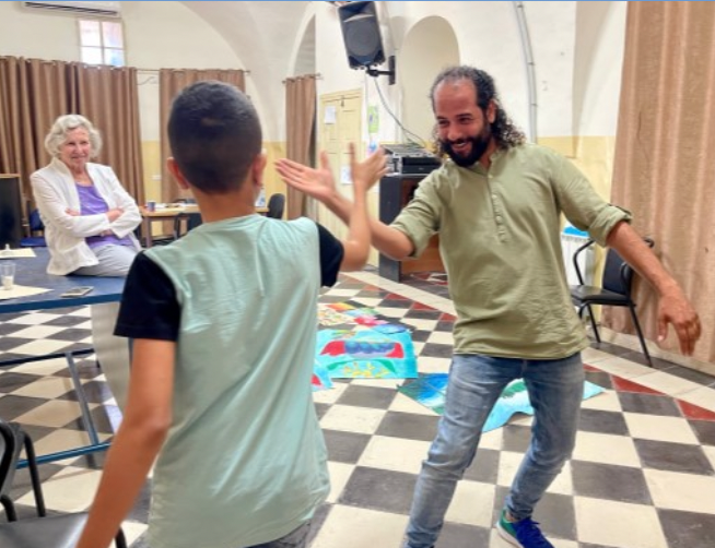 Teacher and student embracing