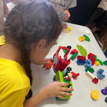 Child playing with Legos